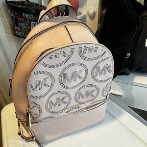 Michael kors backpack used once. Stored in a tote